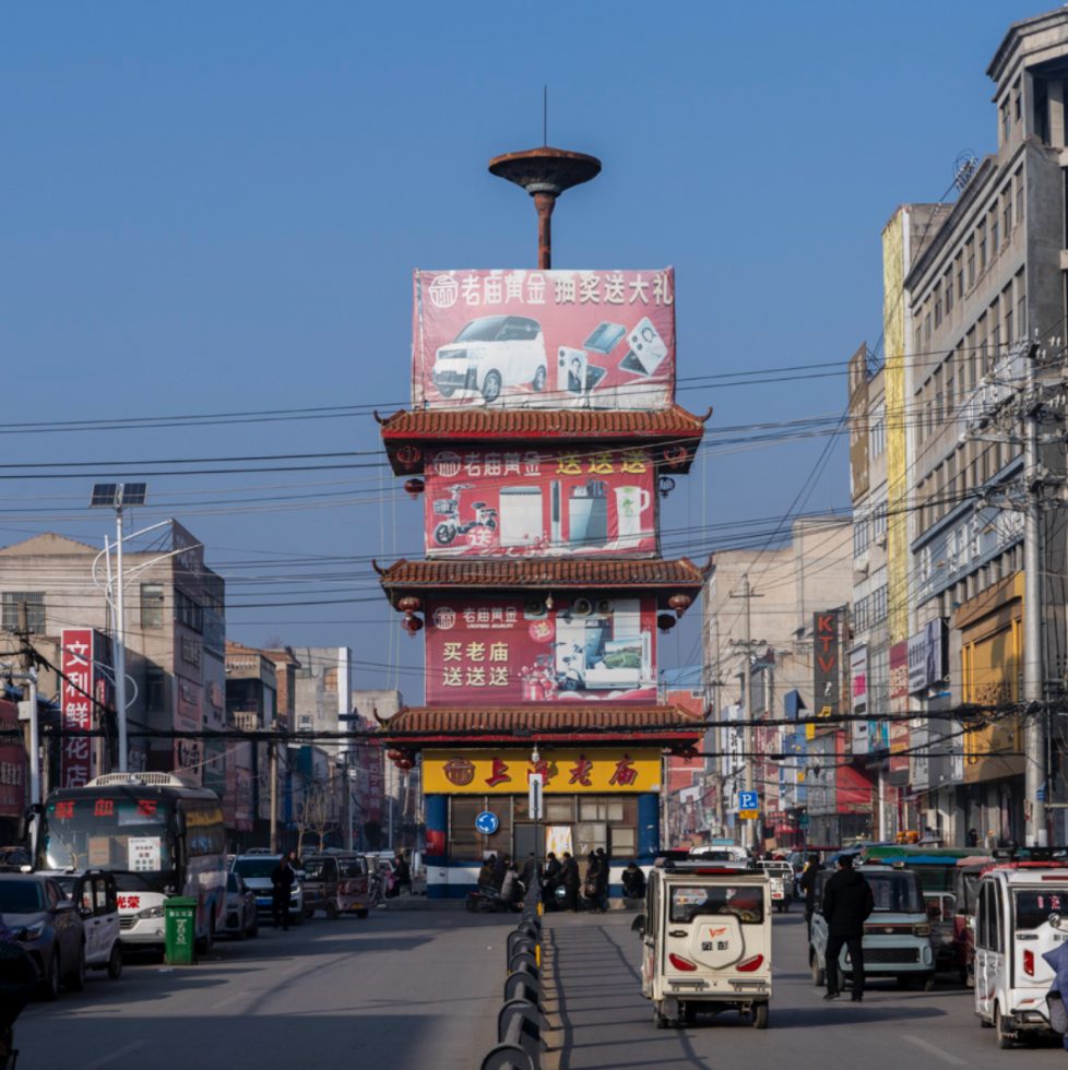 This is a color photograph of a bustling street in China.